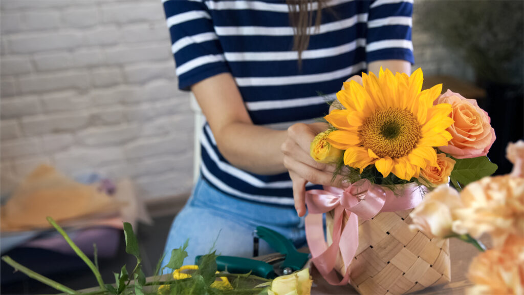 Woman making sunflower bouquet